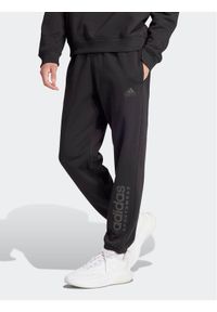 Adidas - adidas Spodnie dresowe ALL SZN Fleece Graphic IW1201 Czarny Regular Fit. Kolor: czarny. Materiał: bawełna #1