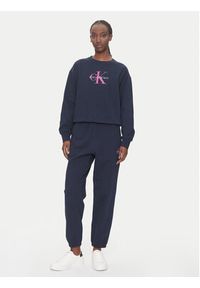 Calvin Klein Jeans Spodnie dresowe Monologo LV047B235G Granatowy Regular Fit. Kolor: niebieski. Materiał: bawełna #4