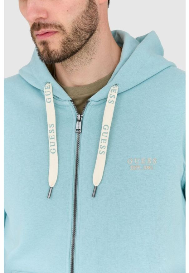 Guess - GUESS Bluza turkusowa rozpinana slim fit. Typ kołnierza: kaptur. Kolor: niebieski