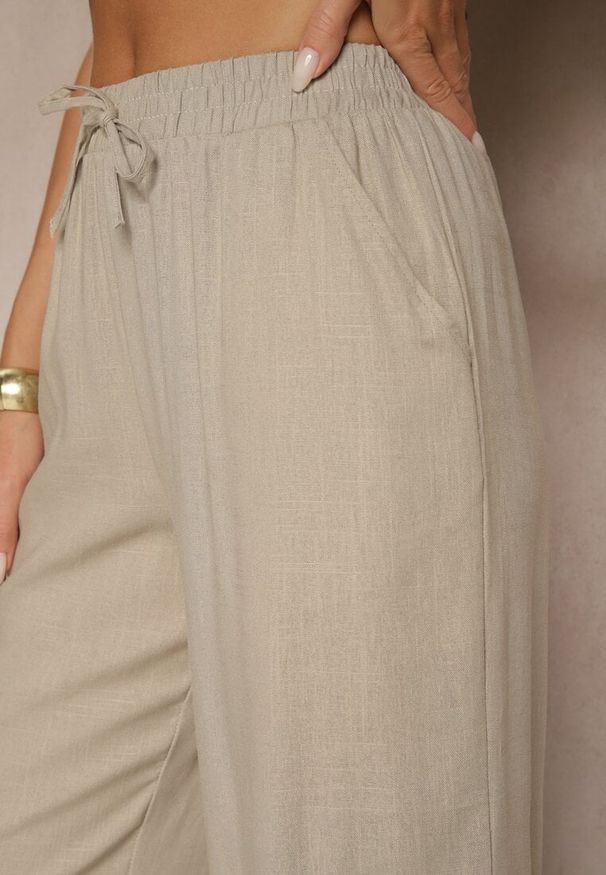 Renee - Beżowe Spodnie z Lnem o Szerokim Kroju z Gumką w Talii Filarive. Okazja: na co dzień. Kolor: beżowy. Materiał: len. Sezon: lato, wiosna. Styl: elegancki, casual