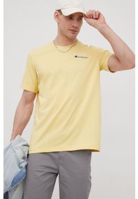 Champion t-shirt bawełniany kolor żółty z aplikacją. Kolor: żółty. Materiał: bawełna. Wzór: aplikacja