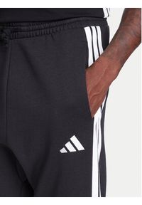 Adidas - adidas Spodnie dresowe Essentials 3-Stripes JD1861 Czarny Regular Fit. Kolor: czarny. Materiał: bawełna #5