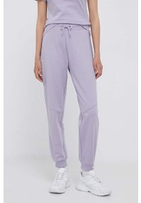 Calvin Klein Jeans spodnie dresowe kolor fioletowy gładkie. Kolor: fioletowy. Materiał: dresówka. Wzór: gładki