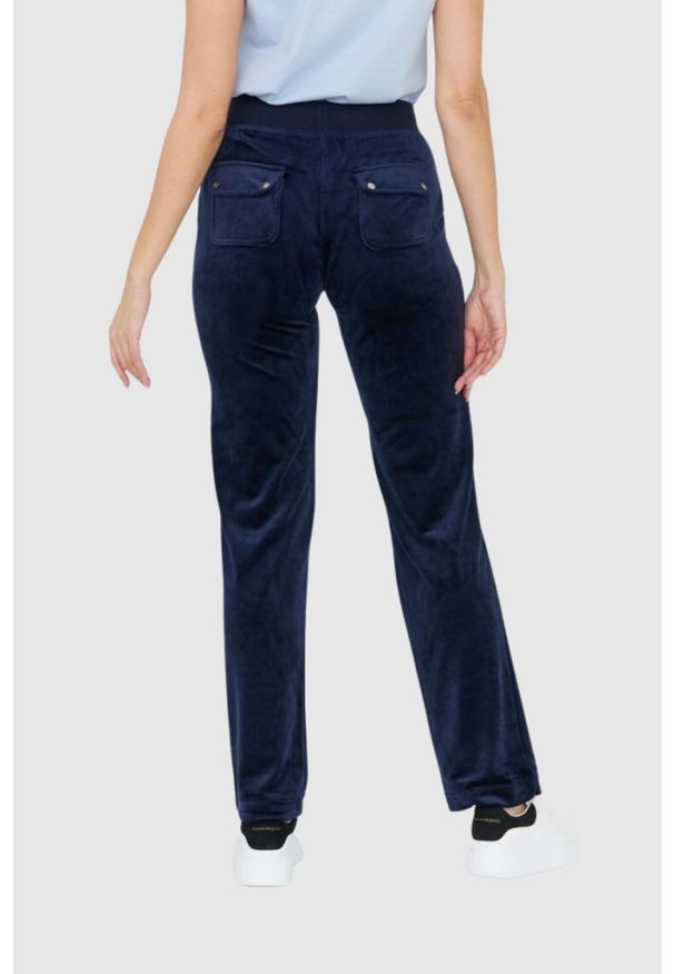 Juicy Couture - JUICY COUTURE Granatowe spodnie dresowe damskie z weluru, Rozmiar M. Kolor: niebieski. Materiał: welur, dresówka