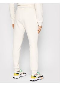 Adidas - adidas Spodnie dresowe adicolor Essentials HE9410 Beżowy Slim Fit. Kolor: beżowy. Materiał: dresówka, bawełna #4