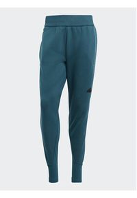 Adidas - adidas Spodnie dresowe IN5100 Turkusowy Regular Fit. Kolor: turkusowy. Materiał: bawełna #4