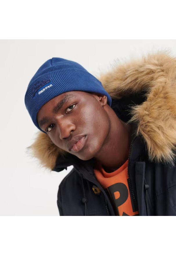 Czapka zimowa męska Superdry Orange Label Beanie. Kolor: niebieski. Materiał: bawełna. Sezon: zima