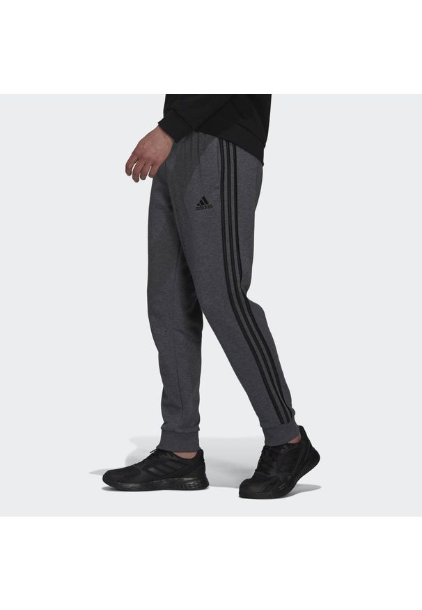 Adidas - Spodnie męskie adidas Essentials French Terry Tapered Cuff 3-Stripes Pants. Kolor: szary, wielokolorowy, czarny. Materiał: bawełna, materiał. Sport: joga i pilates