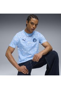 Puma - Męska koszulka Manchester City FtblCulture z nadrukiem na całej powierzchni PUMA. Kolor: niebieski, wielokolorowy, biały. Wzór: nadruk. Sport: piłka nożna