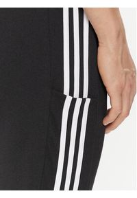 Adidas - adidas Spodnie dresowe Essentials Single Jersey Tapered Open Hem 3-Stripes Joggers IC0044 Czarny Regular Fit. Kolor: czarny. Materiał: bawełna