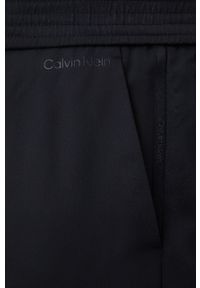 Calvin Klein spódnica kolor czarny mini rozkloszowana. Kolor: czarny. Materiał: materiał, włókno, tkanina. Wzór: gładki