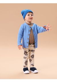 Sinsay - Grubsze legginsy ze wzorem misia - kremowy. Kolor: kremowy