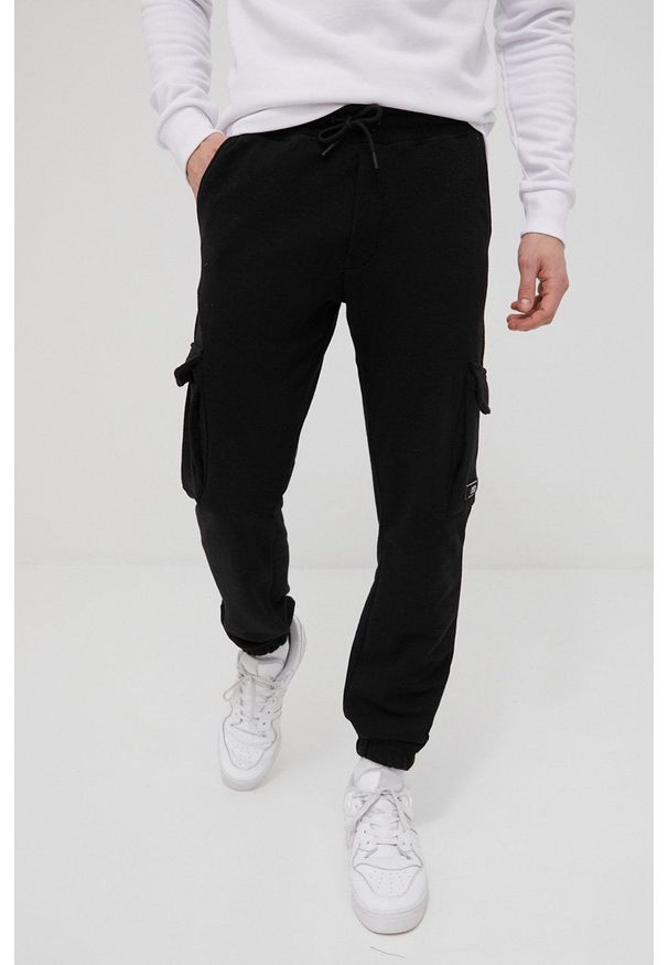 Jack & Jones spodnie męskie kolor czarny gładkie. Kolor: czarny. Materiał: dzianina. Wzór: gładki