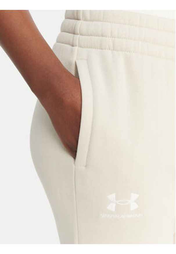 Under Armour Spodnie dresowe UA Icon Fleece 6001537 Beżowy Slim Fit. Kolor: beżowy. Materiał: bawełna