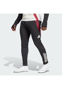 Adidas - Spodnie Manchester United Tiro 24 Training. Kolor: czarny. Materiał: materiał, dresówka. Sport: piłka nożna