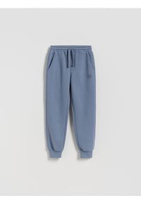 Reserved - Bawełniane joggery z meszkiem - granatowy. Kolor: niebieski. Materiał: bawełna