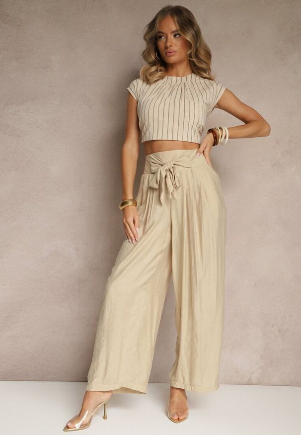 Renee - Beżowe Wiskozowe Spodnie High Waist o Szerokim Kroju Aranisa. Okazja: na co dzień. Stan: podwyższony. Kolor: beżowy. Materiał: wiskoza. Wzór: aplikacja. Styl: elegancki, casual