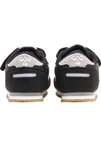 Trenerzy dla dzieci Hummel Reflex. Zapięcie: rzepy. Kolor: czarny. Materiał: guma. Wzór: aplikacja