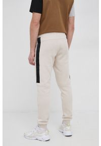Jack & Jones Spodnie męskie kolor kremowy gładkie. Kolor: beżowy. Materiał: dzianina. Wzór: gładki #4