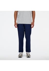 Spodnie męskie New Balance MP41575NNY – granatowe. Kolor: niebieski. Materiał: nylon, bawełna