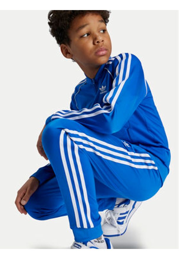 Adidas - adidas Spodnie dresowe adicolor SST IY4007 Niebieski Regular Fit. Kolor: niebieski. Materiał: syntetyk