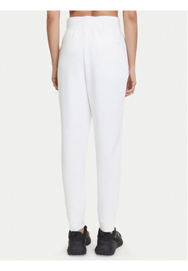 Nike Spodnie dresowe Court DA4722 Biały Slim Fit. Kolor: biały. Materiał: syntetyk