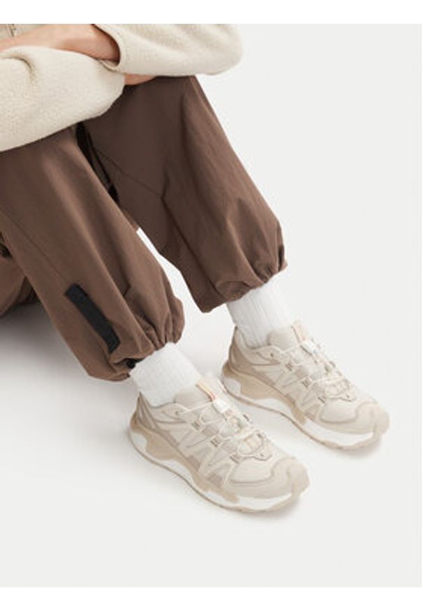 salomon - Salomon Sneakersy Xc Roam L49208200 Beżowy. Kolor: beżowy. Materiał: materiał