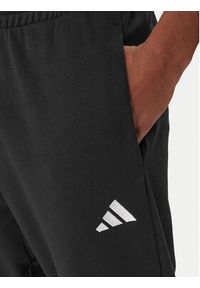 Adidas - adidas Spodnie dresowe Essentials Feel Cozy JE3854 Czarny Regular Fit. Kolor: czarny. Materiał: syntetyk, bawełna #3