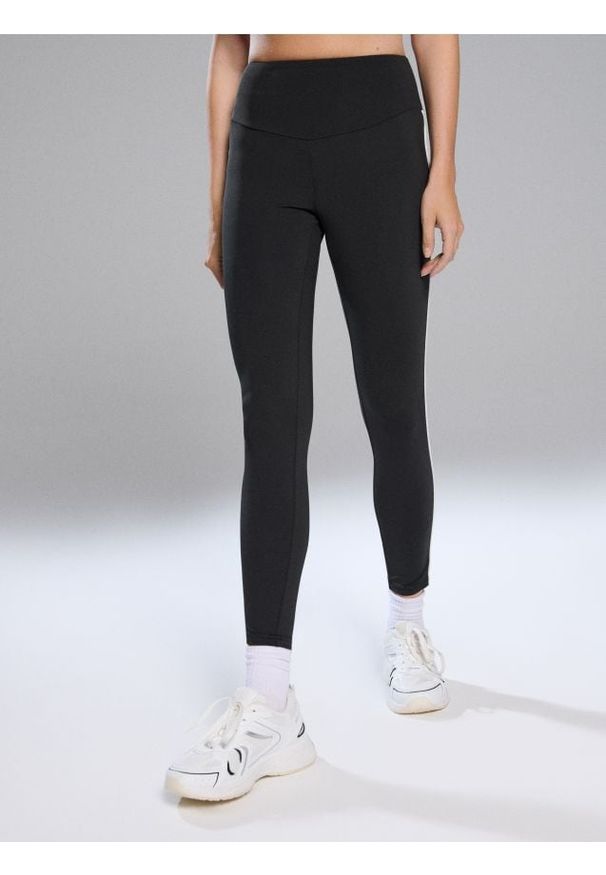 Sinsay - Legginsy sportowe - czarny. Kolor: czarny. Styl: sportowy