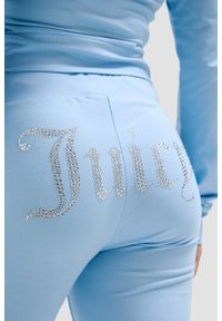 Juicy Couture - JUICY COUTURE Błękitne damskie spodnie dresowe Single Jersey Apollo Low Rise, Rozmiar S. Kolor: niebieski. Materiał: dresówka, jersey