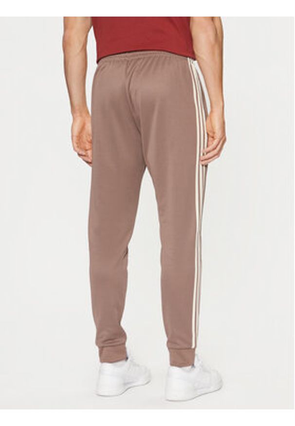 Adidas - adidas Spodnie dresowe adicolor Classics SST JP2518 Beżowy Slim Fit. Kolor: beżowy. Materiał: bawełna