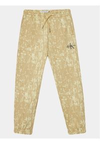 Calvin Klein Jeans Spodnie dresowe Second Skin IB0IB01932 Beżowy Relaxed Fit. Kolor: beżowy. Materiał: bawełna