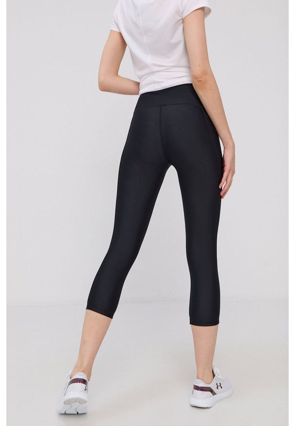 Under Armour - Legginsy. Kolor: czarny. Materiał: dzianina. Wzór: gładki