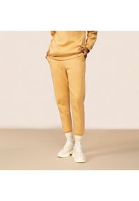 outhorn - Spodnie dresowe damskie - żółte. Kolor: żółty. Materiał: dresówka. Wzór: nadruk #11