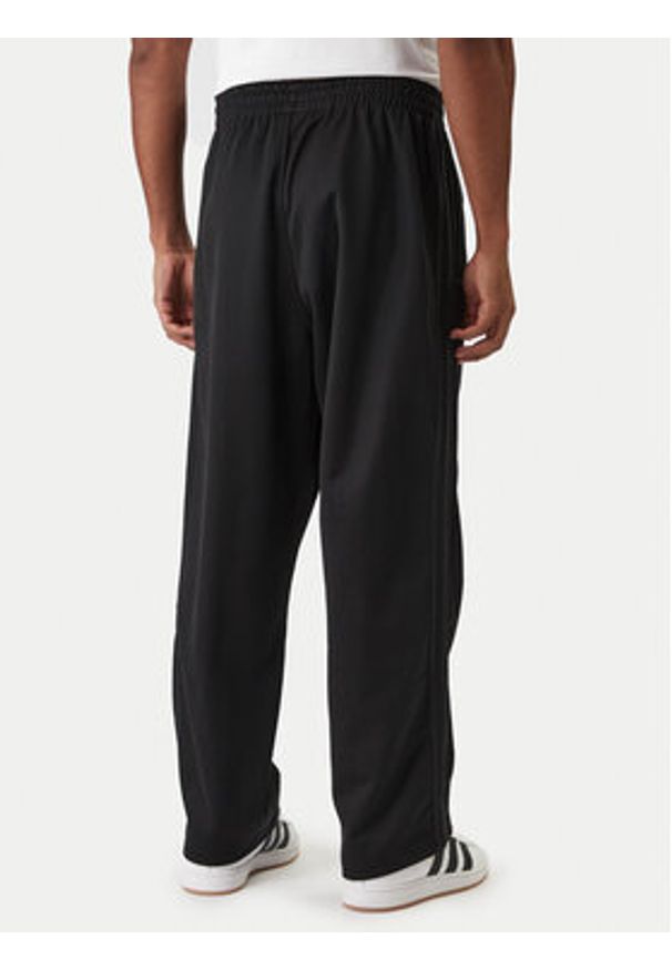 Adidas - adidas Spodnie dresowe adicolor KE3500 Czarny Loose Fit. Kolor: czarny. Materiał: bawełna