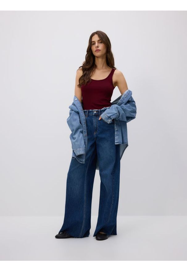 Reserved - Jeansy wide leg z rozdarciami - niebieski. Kolor: niebieski
