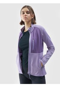 4f - Bluza do biegania w terenie rozpinana bez kaptura damska - fioletowa. Typ kołnierza: bez kaptura. Kolor: fioletowy. Materiał: skóra, tkanina, elastan, dzianina, materiał, syntetyk. Długość rękawa: raglanowy rękaw. Długość: długie. Wzór: gładki, kolorowy. Styl: sportowy, rockowy. Sport: bieganie, fitness #1