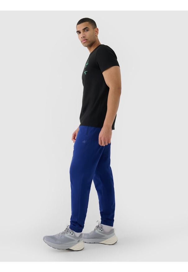 4f - 4F Spodnie dresowe joggery męskie - granatowe XXL. Kolor: niebieski. Materiał: dresówka. Wzór: gładki, ze splotem