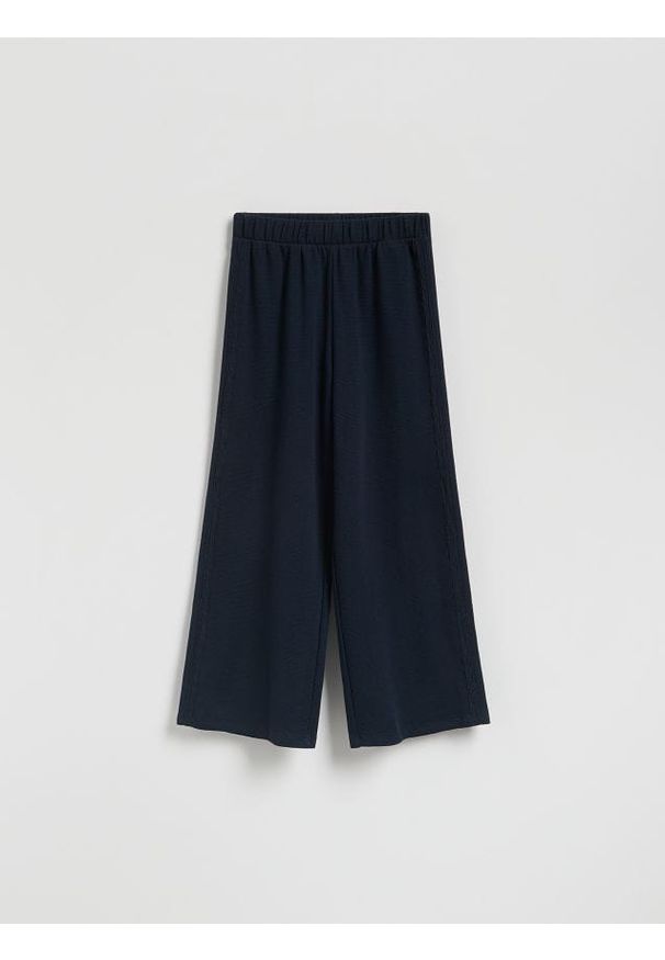Reserved - Bawełniane spodnie z lampasami - granatowy. Kolor: niebieski. Materiał: bawełna