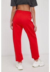 adidas Originals Spodnie HF7513 damskie kolor czerwony gładkie. Stan: podwyższony. Kolor: czerwony. Materiał: bawełna, poliester, dzianina. Wzór: gładki #4