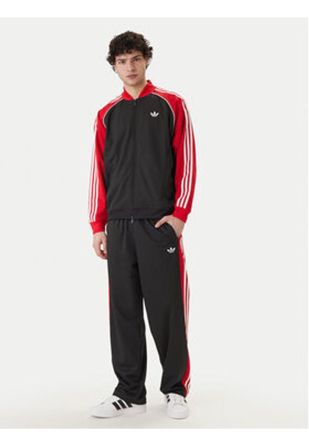 Adidas - adidas Spodnie dresowe KE0117 Czarny Loose Fit. Kolor: czarny. Materiał: syntetyk