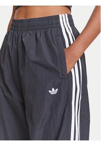 Adidas - adidas Spodnie dresowe adicolor Teamgeist JD0256 Czarny Oversize. Kolor: czarny. Materiał: syntetyk