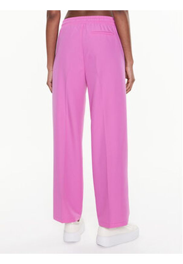 United Colors of Benetton - United Colors Of Benetton Spodnie materiałowe 40K6DF035 Różowy Relaxed Fit. Kolor: różowy. Materiał: materiał, syntetyk
