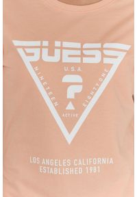 Guess - GUESS Brzoskwiniowy t-shirt damski z białym logo, Rozmiar XS. Kolor: pomarańczowy. Materiał: bawełna. Wzór: nadruk