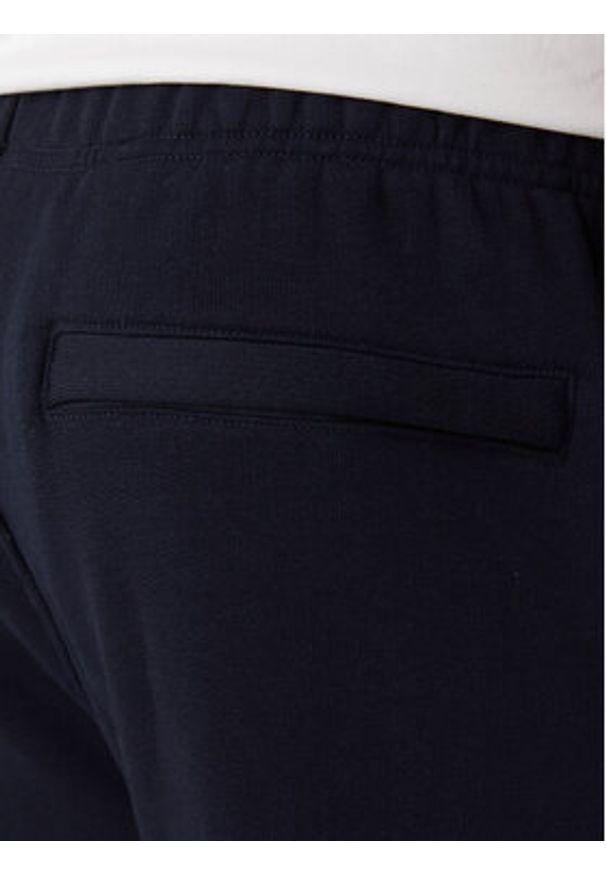Guess Jeans Spodnie dresowe M6RB70 KCPR1 Granatowy Regular Fit. Kolor: niebieski. Materiał: bawełna