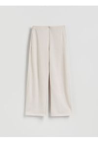 Reserved - Dzianinowe spodnie z bawełną - beżowy. Kolor: beżowy. Materiał: bawełna, dzianina #1