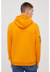 Superdry bluza męska kolor pomarańczowy z kapturem z aplikacją. Typ kołnierza: kaptur. Kolor: pomarańczowy. Materiał: dzianina. Wzór: aplikacja