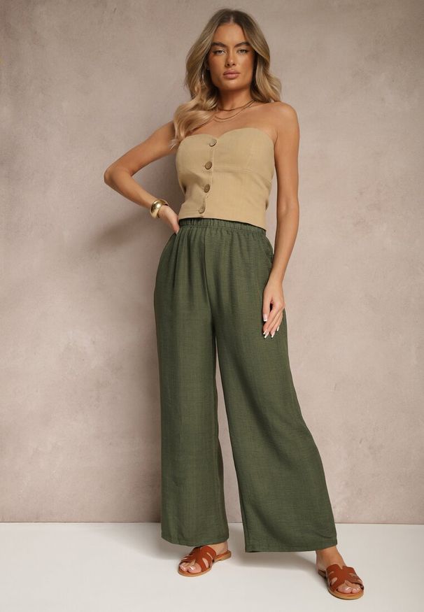 Renee - Ciemnozielone Spodnie Typu Palazzo High Waist o Szerokim Kroju Arathira. Okazja: na co dzień, na imprezę. Stan: podwyższony. Kolor: zielony. Materiał: jedwab. Długość: długie. Styl: elegancki, casual