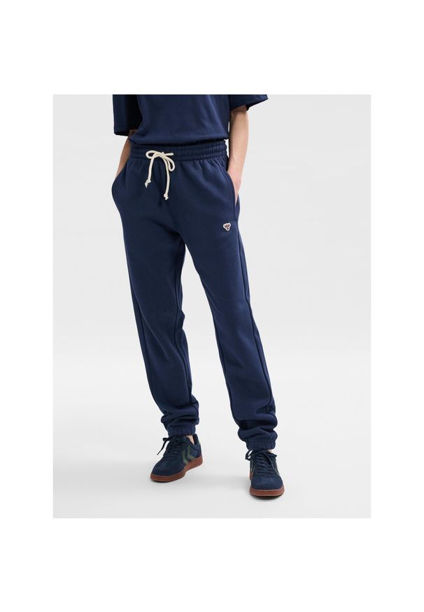 Spodnie dresowe regularne Hummel Bee. Kolor: niebieski, wielokolorowy, zielony. Materiał: dresówka. Sport: bieganie, fitness