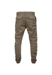 Urban Classics - Spodnie Do Joggingu Damskie Rozciągliwe. Kolor: zielony. Długość: długie. Sport: bieganie